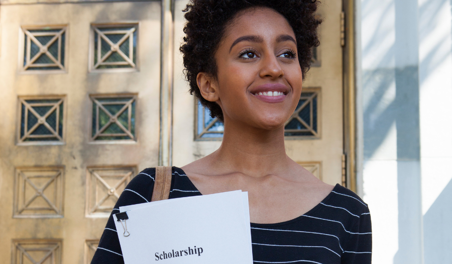 Woman smiling with scholarship application