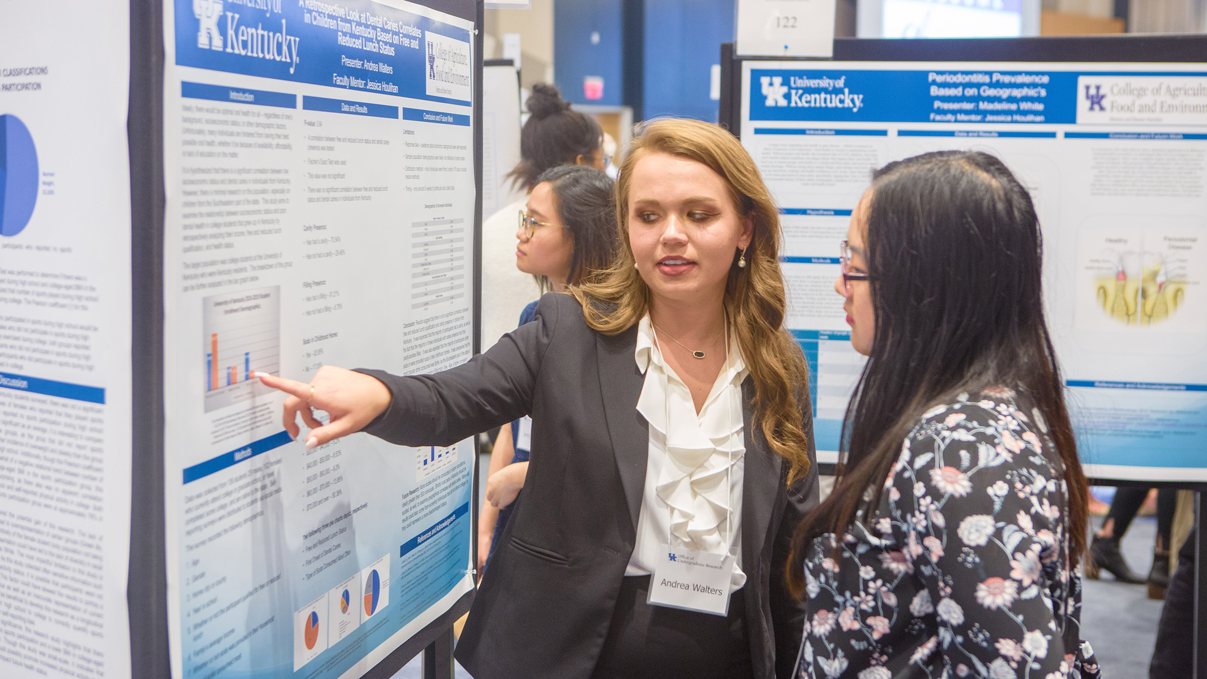 A student presents a research poster