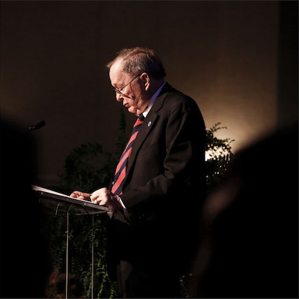 Bill Gatton at a podium