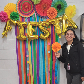 Gabby Rodriguez with fiesta balloons